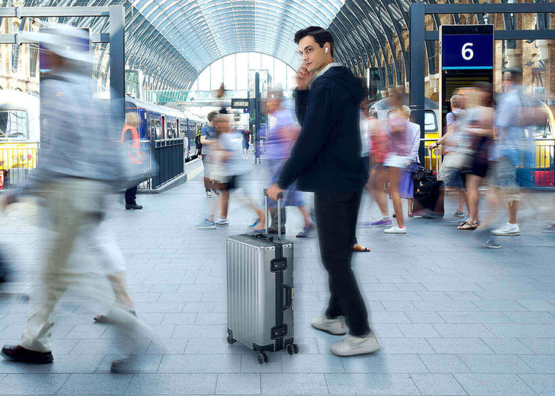 A man uses M3 Translation Earbud for calling